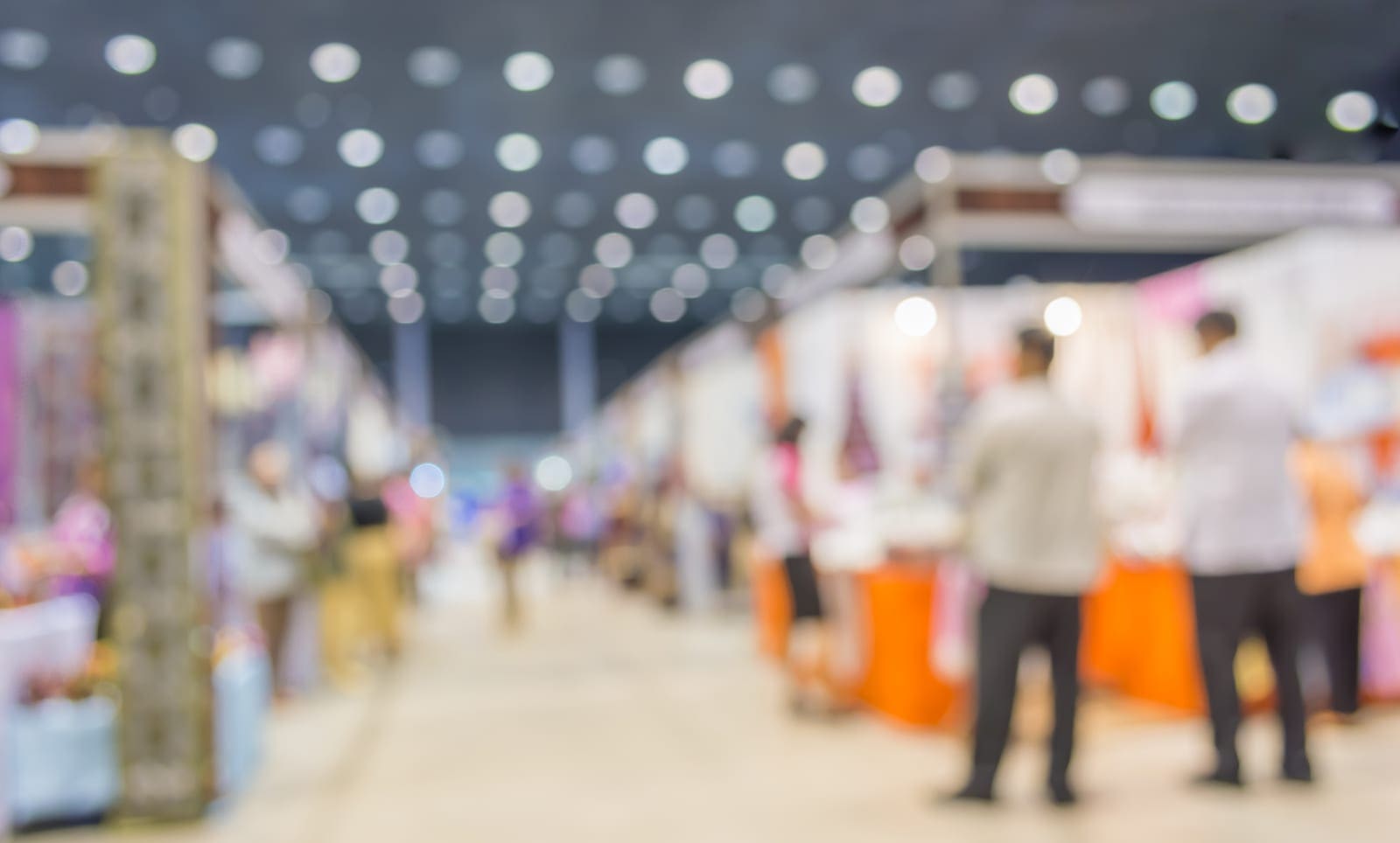 a blurry image of a trade show floor