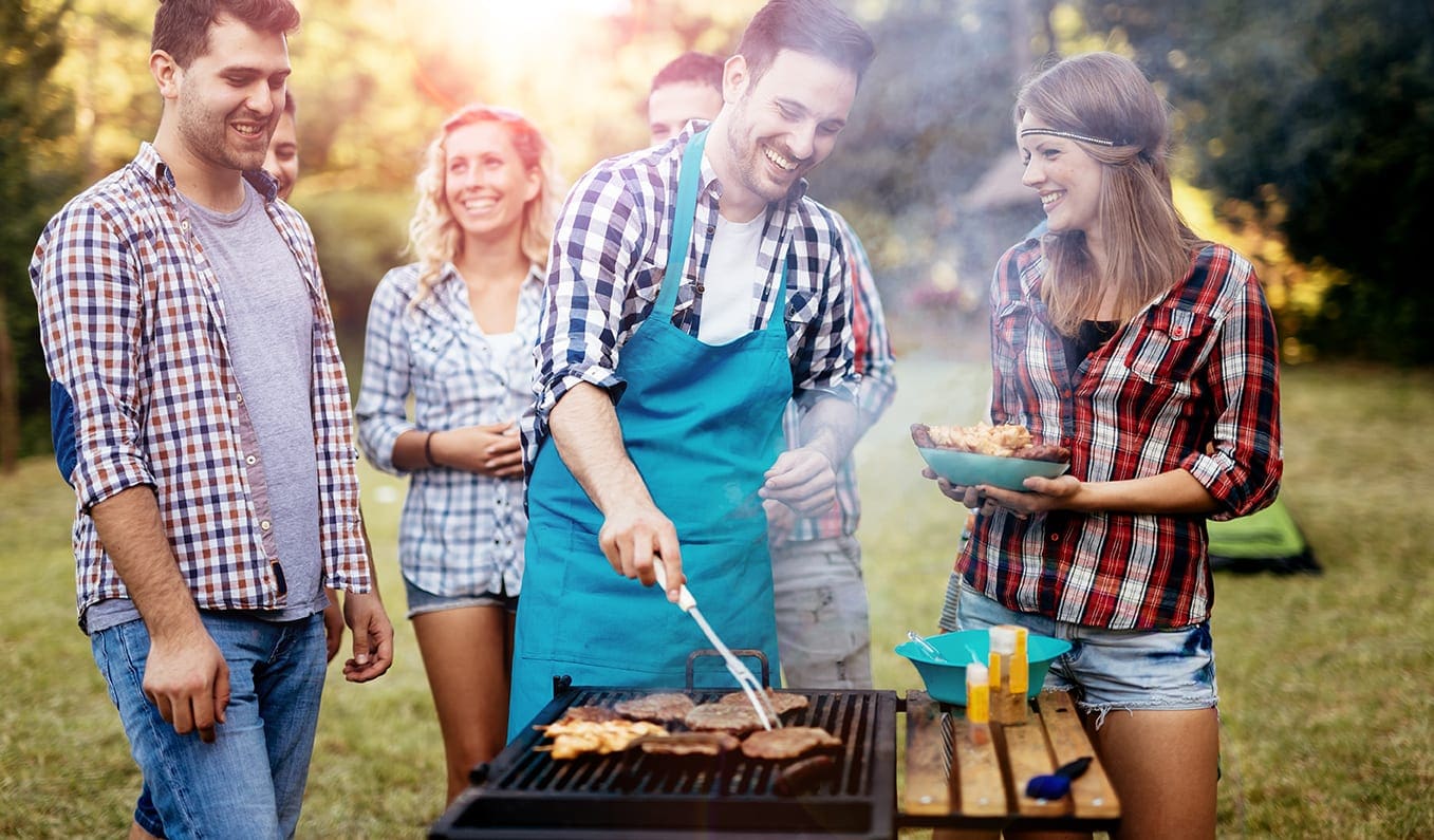 a group of people at a BBQ