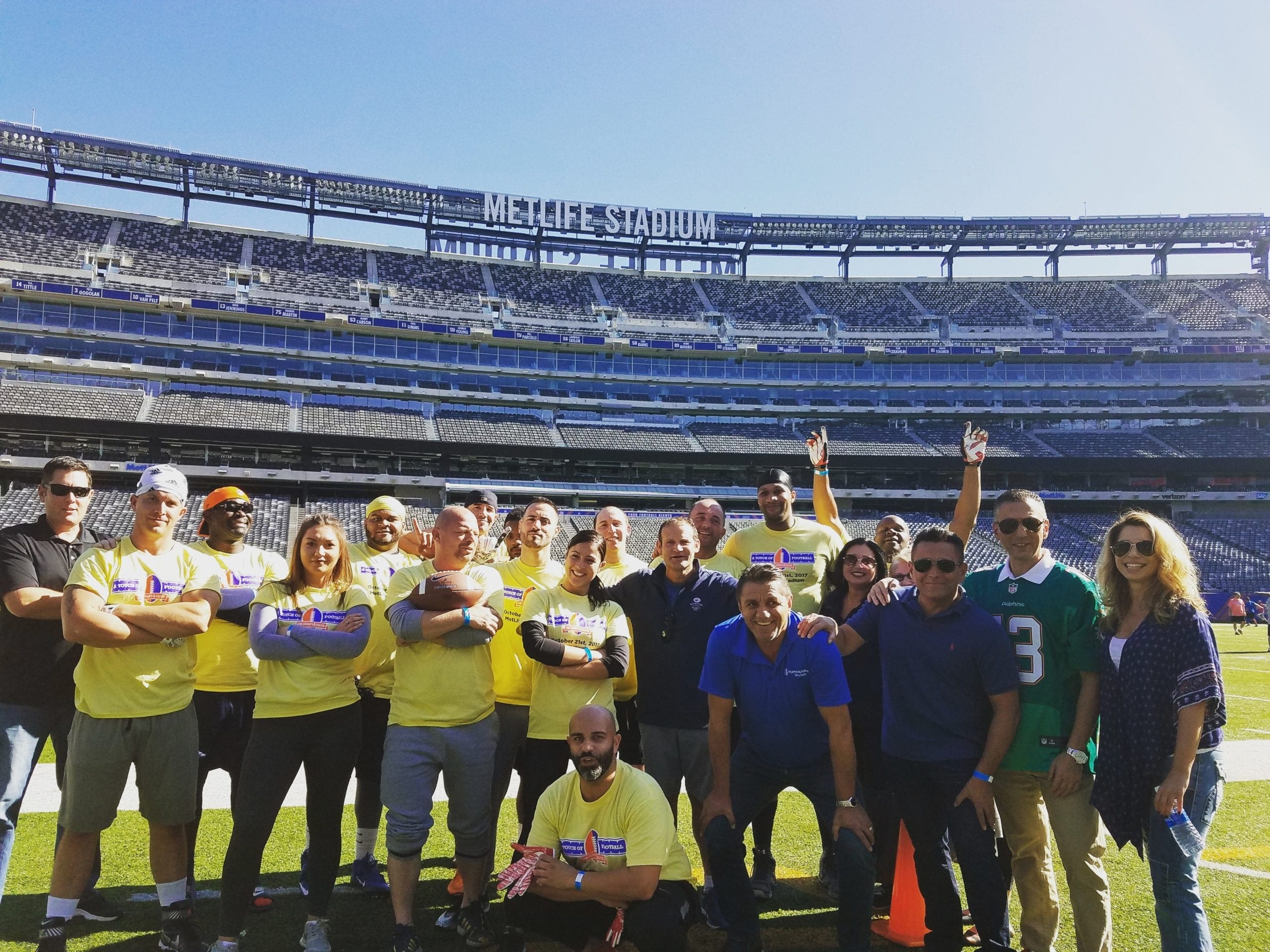 Planned employees at a charity event at Giants Stadium