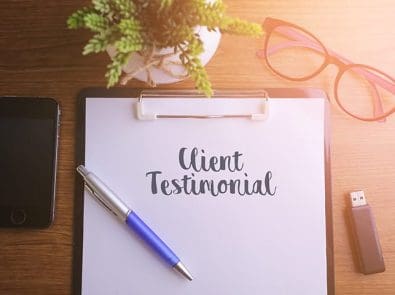 a pad of paper with "client testimonial" on it