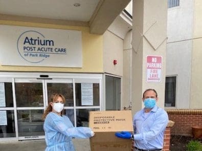 Robert Francis of Planned donating protective masks to Atrium Post Acute Care