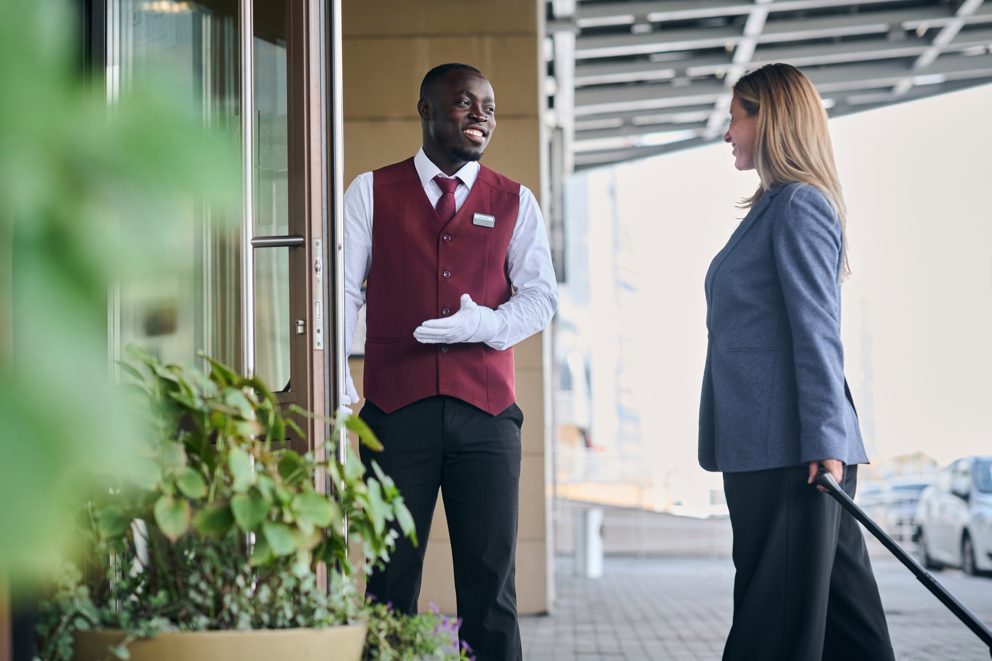 Doorman opening door for guest